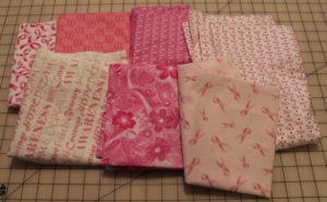 Breast Cancer Quilts - Some of the various breast cancer awareness fabric I collected